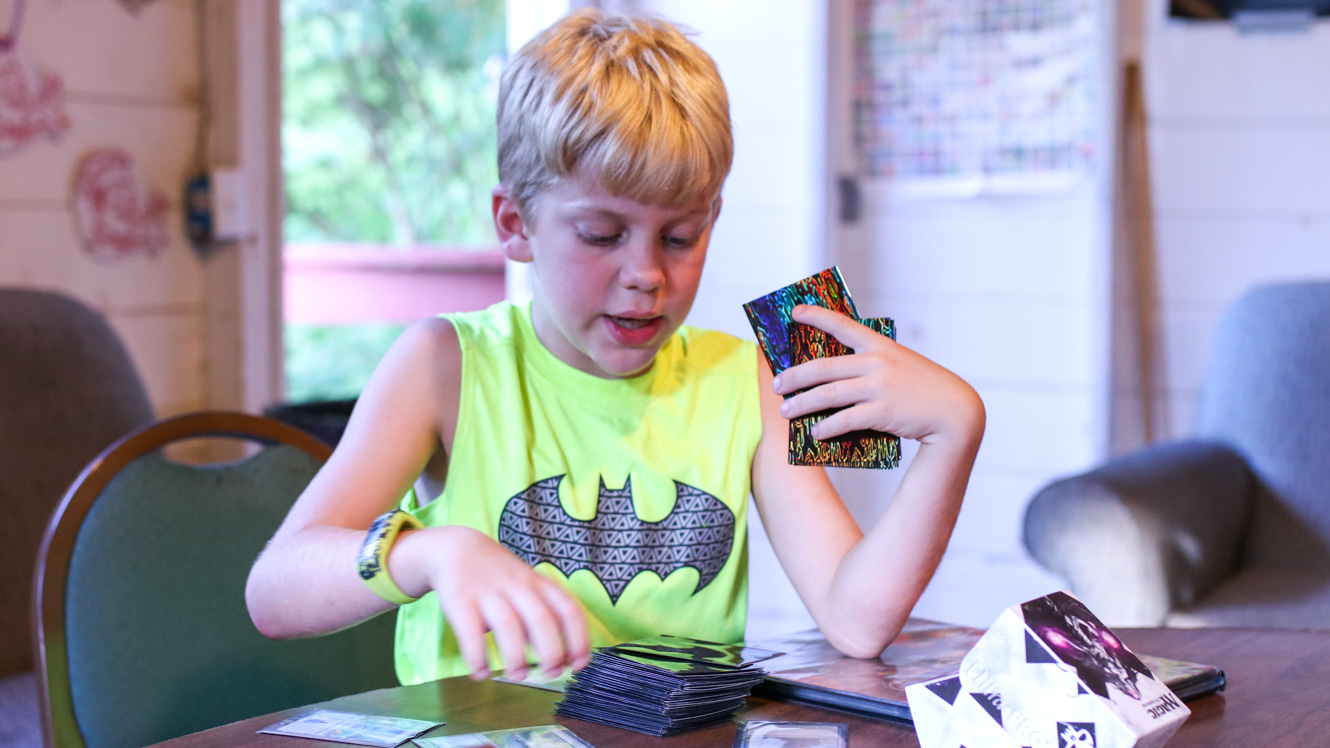 Camper sorts Magic: The Gathering cards