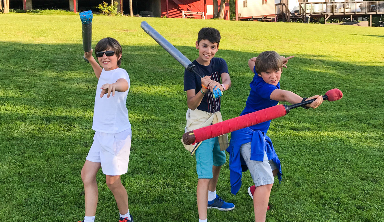 LARPing campers post with foam swords