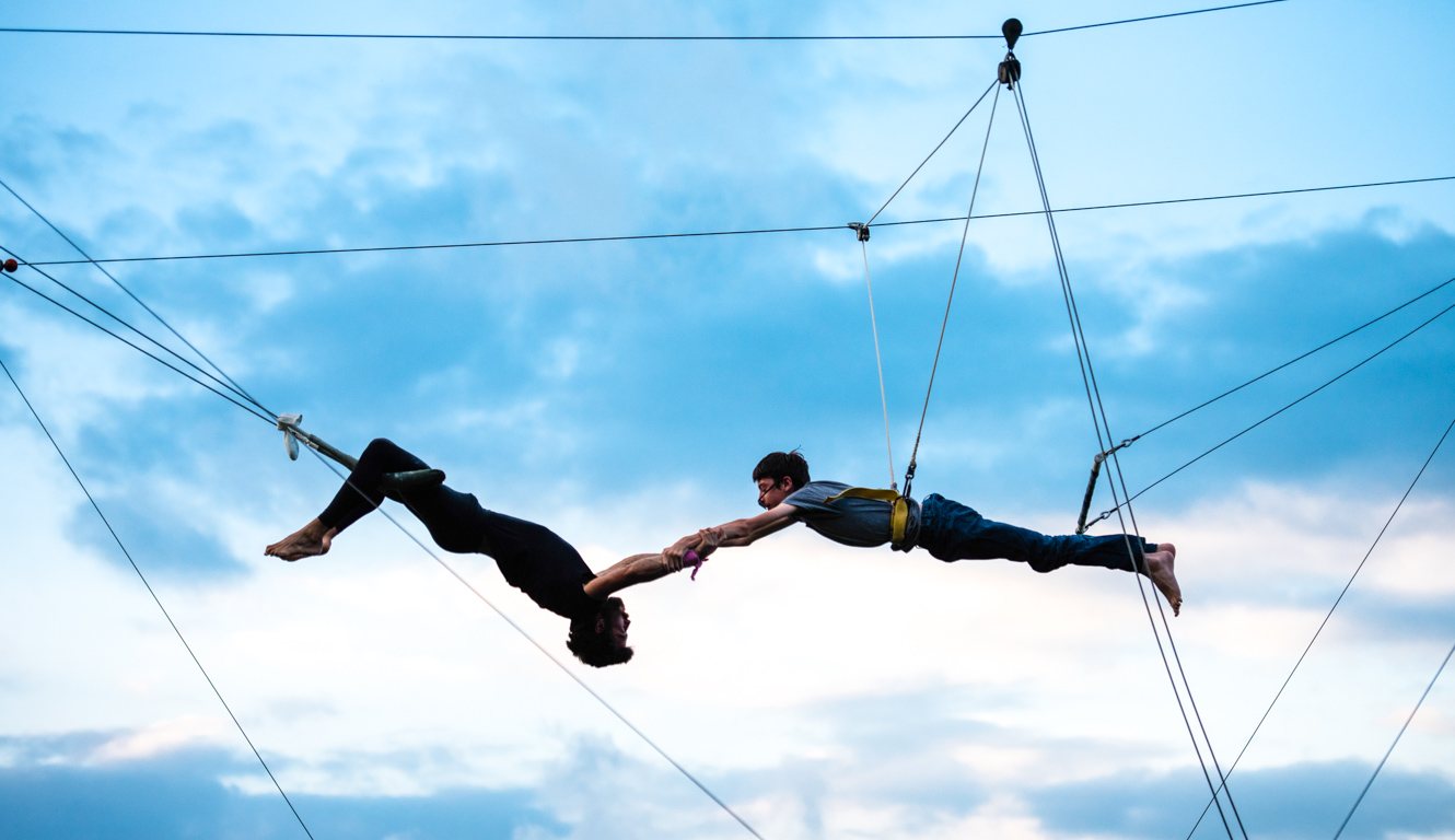 Campers perform on outdoor trapeze