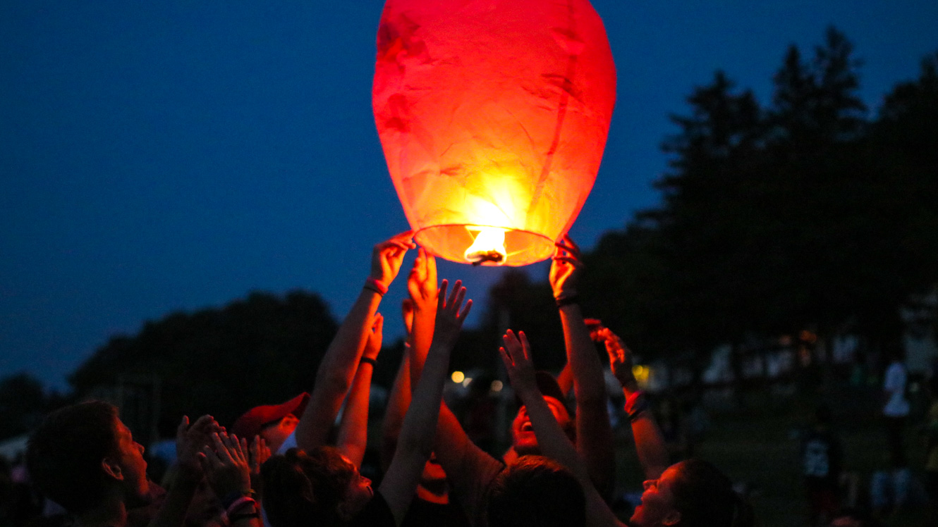 Campers release floating lantern