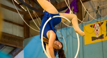 Camper does acrobatics on circus hoop