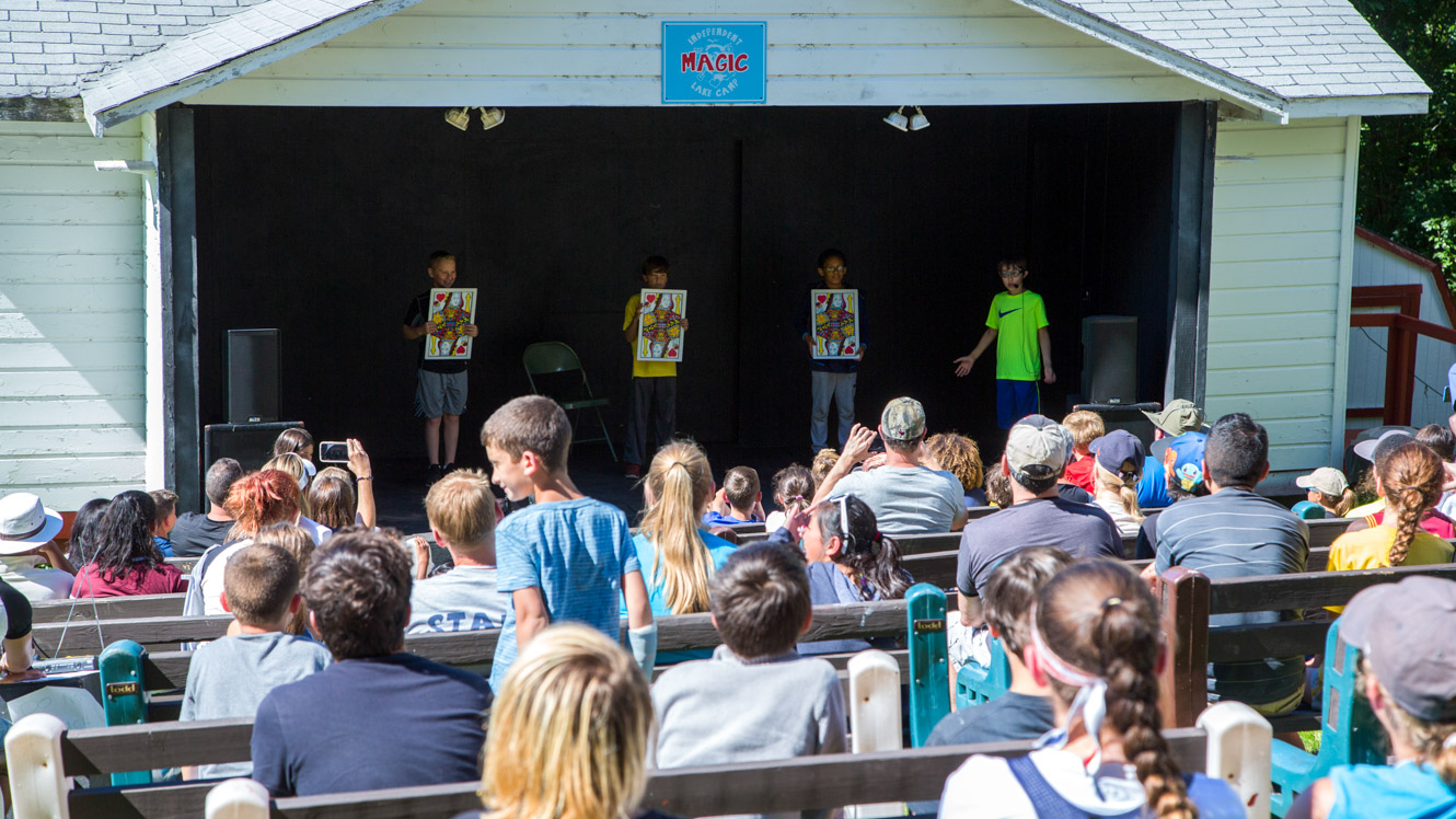 Campers perform magic show for audience